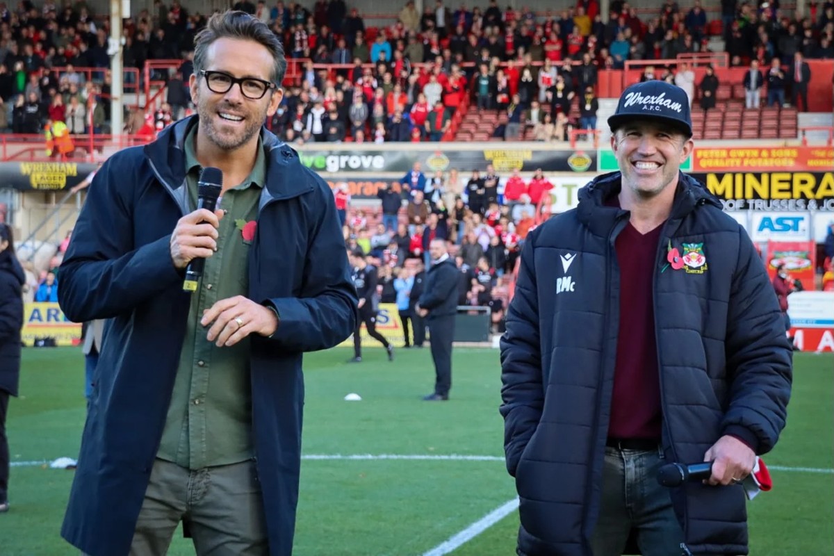 Ryan Reynolds (left) and Rob McElhenney introducing themselves to Wrexham at the home stadium.